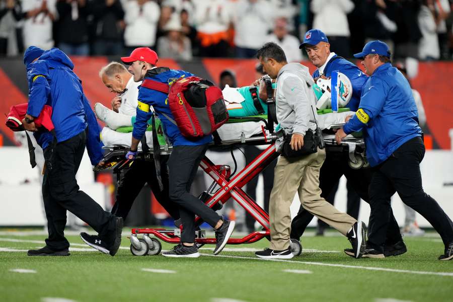 Miami Dolphins quarterback Tua Tagovailoa (1) is taken off the field after suffering a head injury