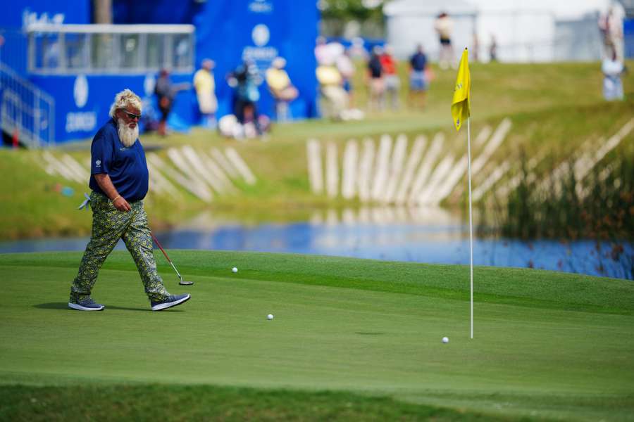 John Daly walks the 18th green during the first round of the Zurich Classic of New Orleans tournament