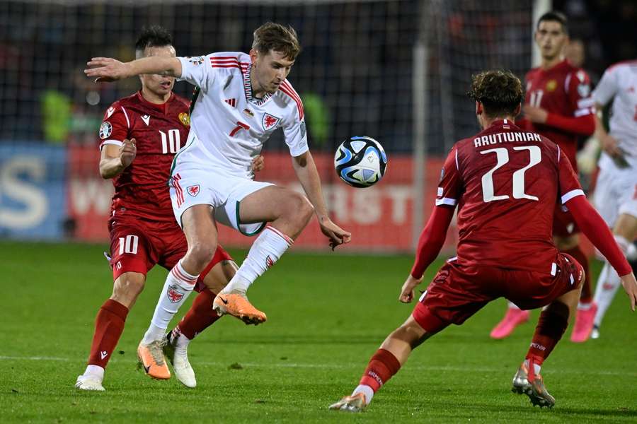 Wales' David Brooks fights for the ball with Armenia's Georgii Arutiunian