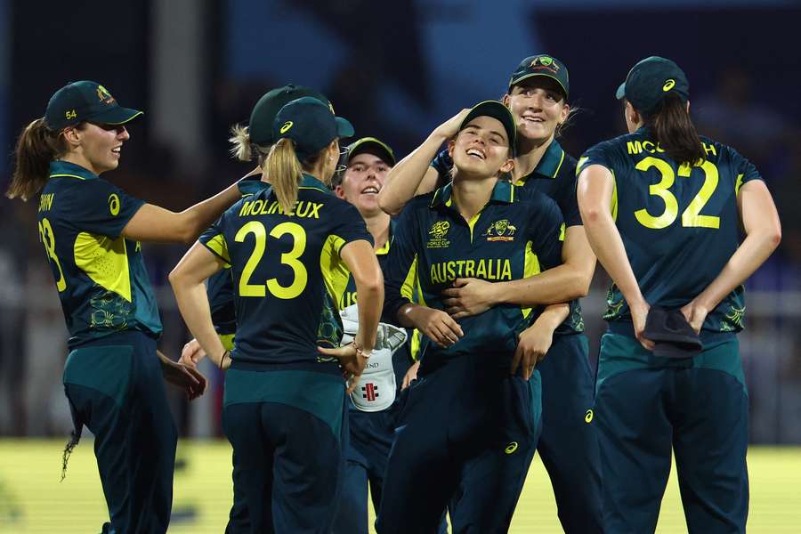 Phoebe Litchfield of Australia celebrates with teammates after a run out