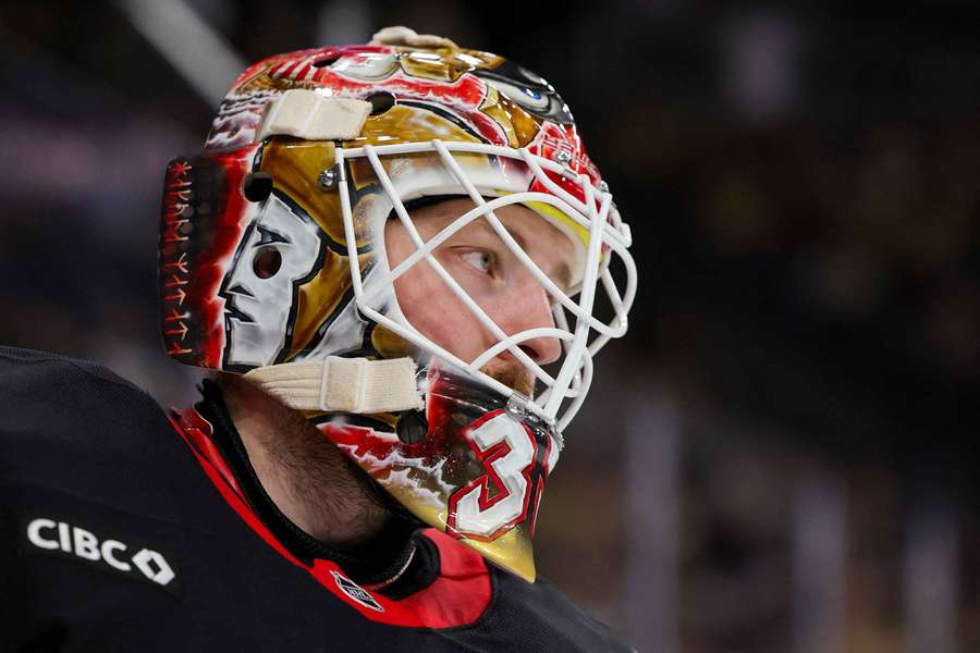 Ottawa Senators goalie Linus Ullmark taking a break during a stoppage in play
