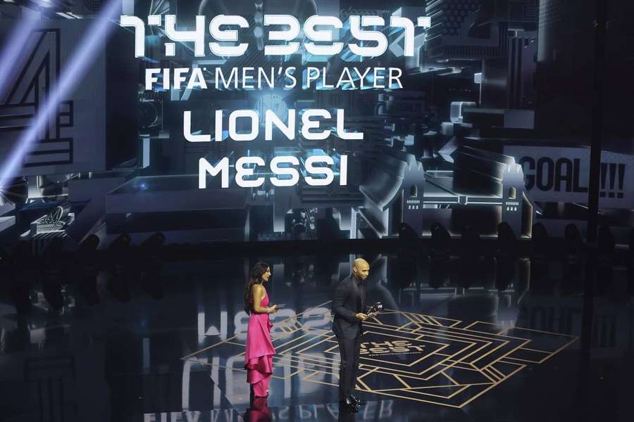 Thierry Henry collects the award on behalf of Lionel Messi who won The Best FIFA Men's Player