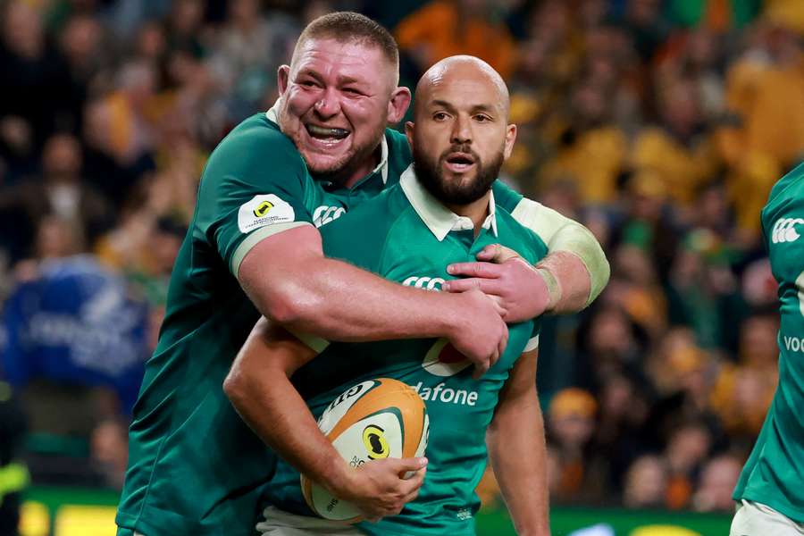 Ireland scrum-half Jamison Gibson-Park (R) celebrates scoring a try with teammate Tadhg Furlong