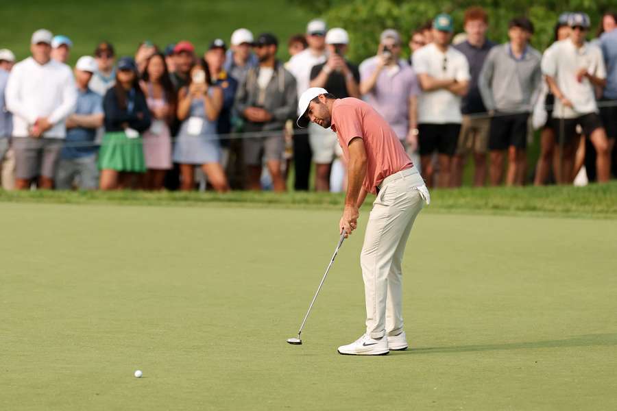 Scottie Scheffler putts on the 13th green during the third round of the Memorial Tournament on Saturday