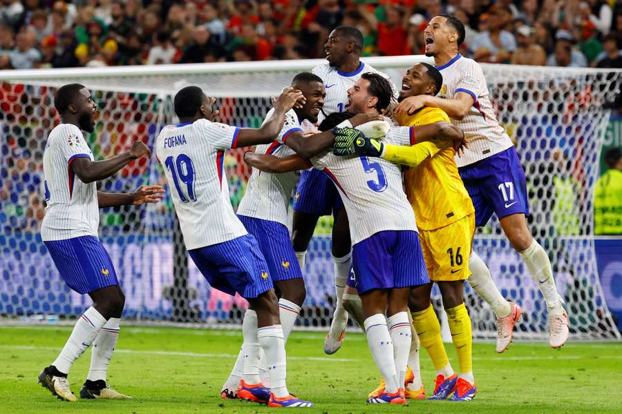 France celebrate their penalty shootout win against Portugal