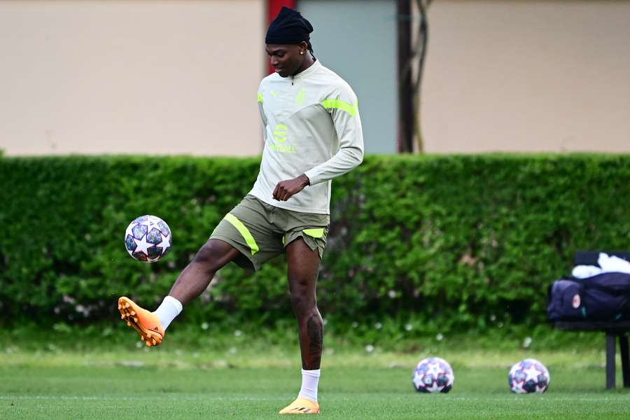 AC Milan forward Rafael Leao plays with a ball during a training session