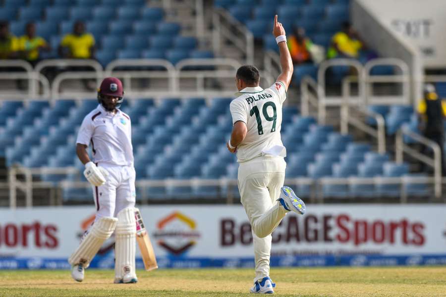 Scott Boland (3-34) celebrates one of his three first innings wickets at Sabina Park.