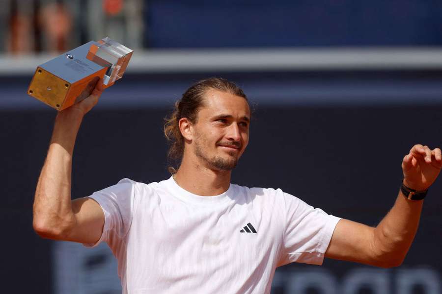 Alexander Zverev celebrates with the trophy after winning the Munich Open 