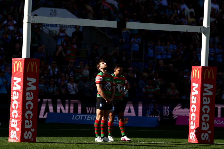 Jai Arrow and Cody Walker standing on-field at kickoff against the Titans. 