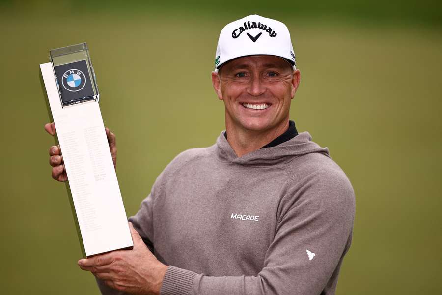 Sweden's Alex Noren poses with the trophy after winning the BMW PGA Championship