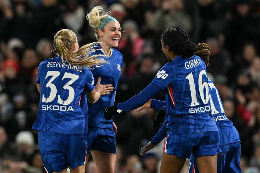 Chelsea celebrate after Ellie Carpenter had given the hosts the lead
