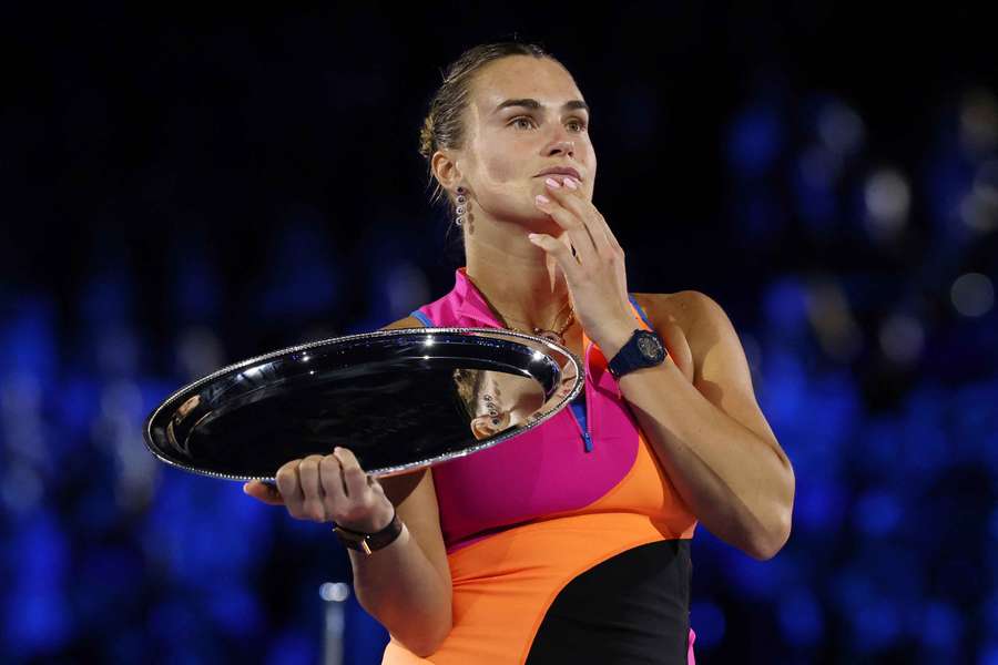 Aryna Sabalenka on the podium with the runner-up trophy after the women's singles final against Elena Rybakina