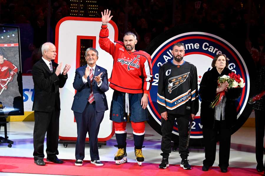 Ovechkin salutes the crowd during a ceremony to honour scoring an NHL second-best 802 career goals