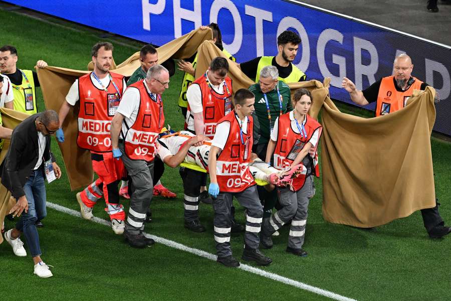 Barnabas Varga is stretchered off the pitch on Monday