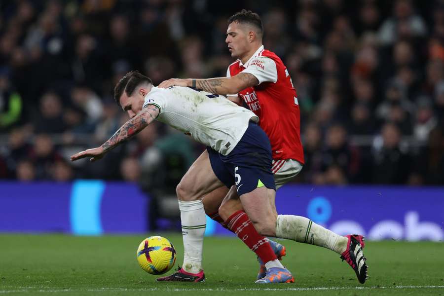 Pierre-Emile Hojbjerg is fouled by midfielder Granit Xhaka