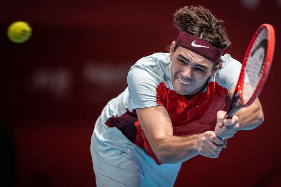 Taylor Fritz of the United States in action against Australia's James Duckworth at the Japan Open.