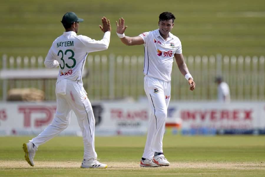 Bangladesh's Taskin Ahmed, right, celebrates with teammate after taking the wicket of Pakistan's Saim Ayub