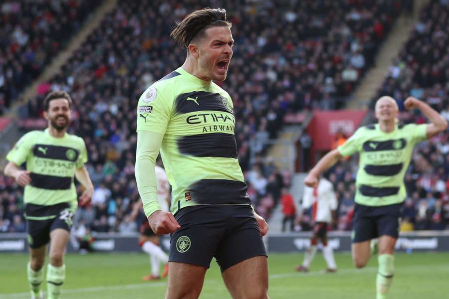 Manchester City's English midfielder Jack Grealish celebrates after scoring their second goal