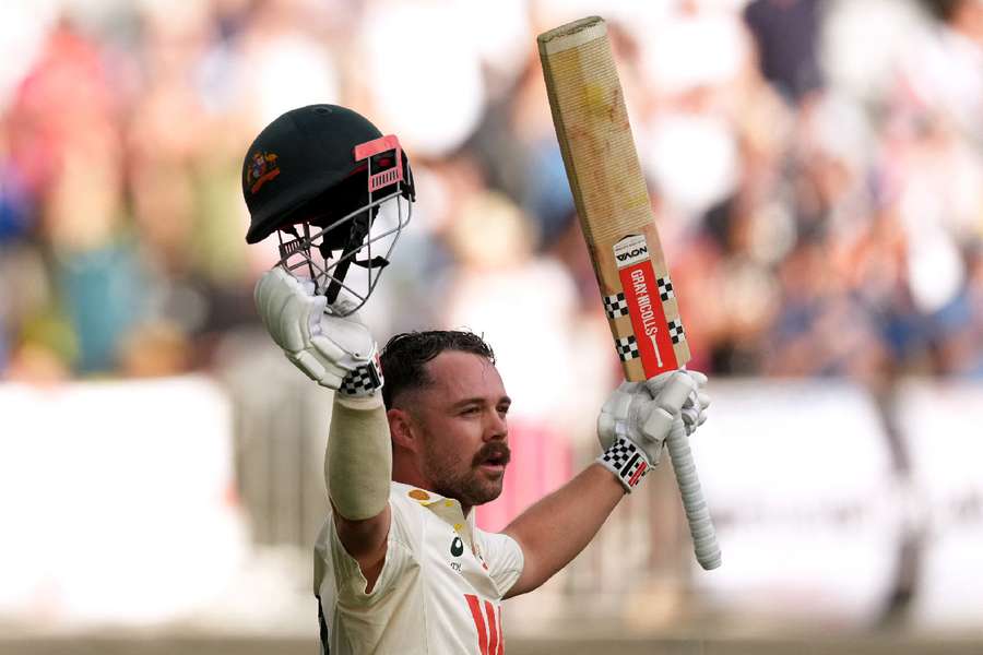 Travis Head raises his bat as he walks after losing his wicket Travis Head raises his bat as he walks after losing his wicket