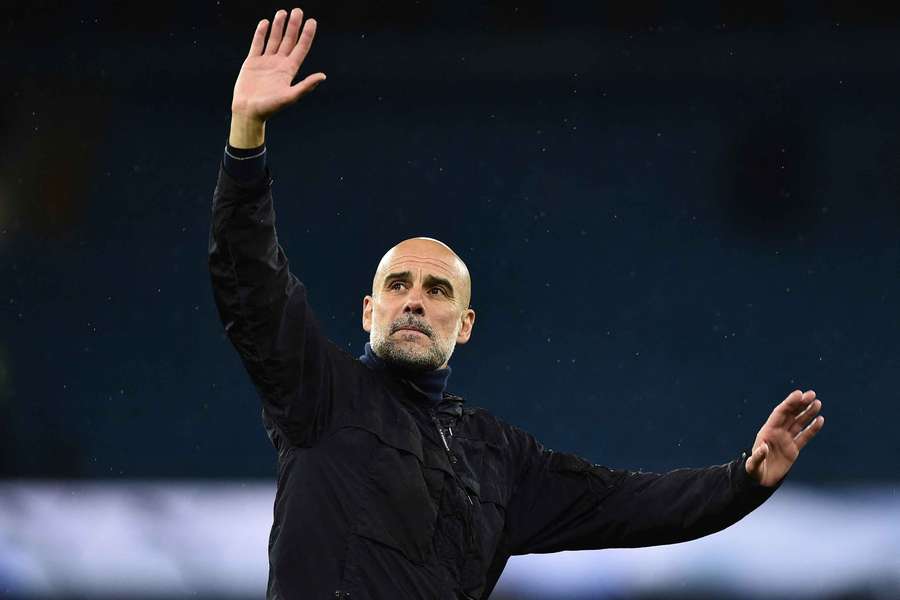 Pep Guardiola waves to Manchester City fans Pep Guardiola waves to Manchester City fans