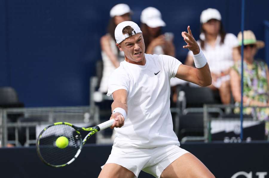 Holger Rune in action during the tournament at Queens