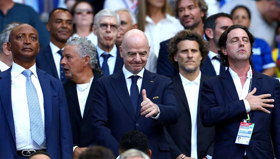 Forlan flanked by Gianni Infantino and Ignacio Alonso Forlan flanked by Gianni Infantino and Ignacio Alonso