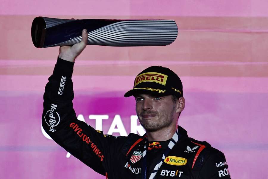 Verstappen holds his trophy aloft
