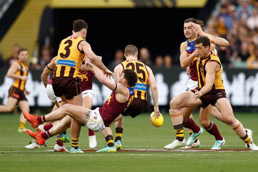 Lachie Neale colliding with Hawthorn's Jai Newcombe during the preliminary final. Lachie Neale colliding with Hawthorn's Jai Newcombe during the preliminary final.