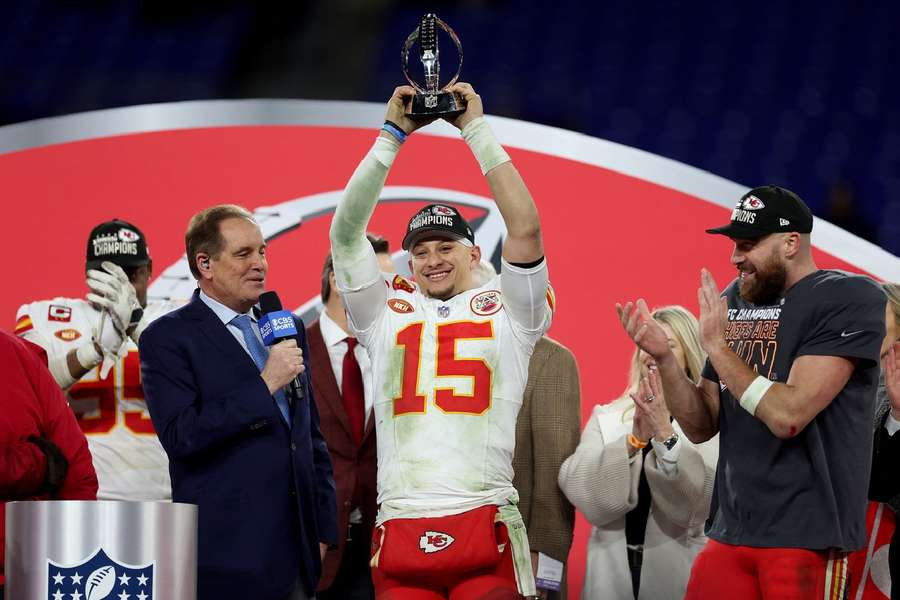 Mahomes celebrates with the Lamar Hunt Trophy