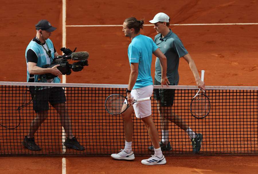 Alex Zverev and Jannik Sinner leave the court