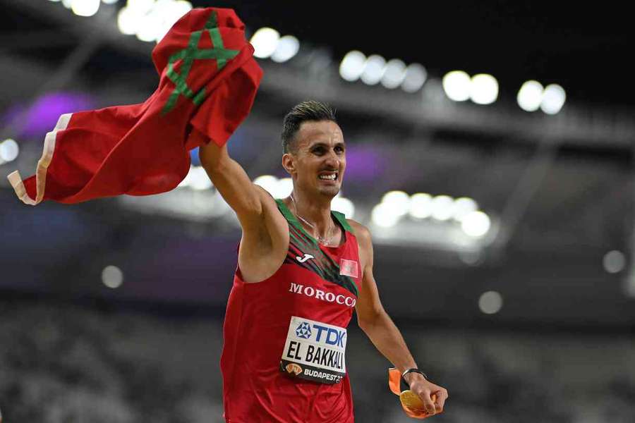 Soufiane El Bakkali celebrates after winning gold in the men's 5,000m steeplechase