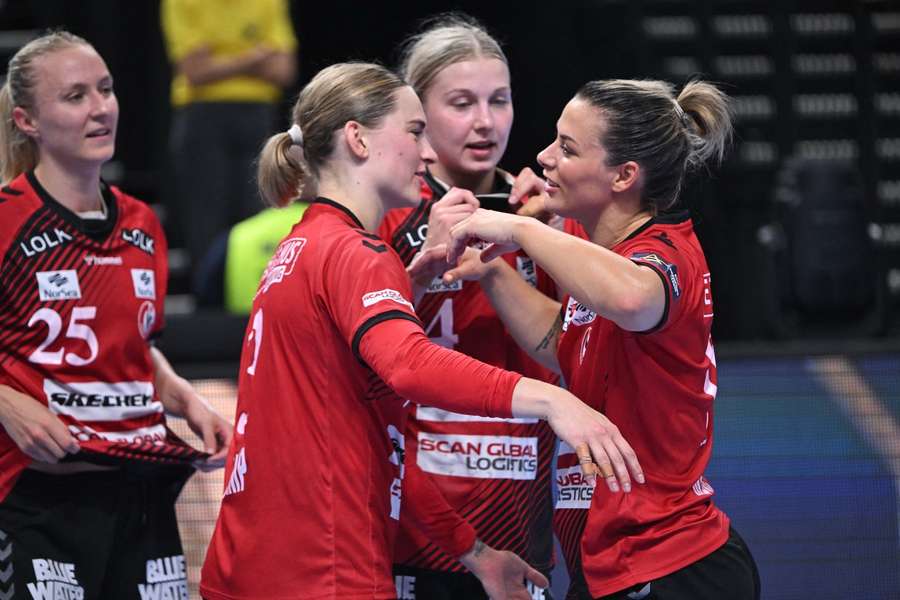 Team Esbjerg celebrate their win against Dortmund