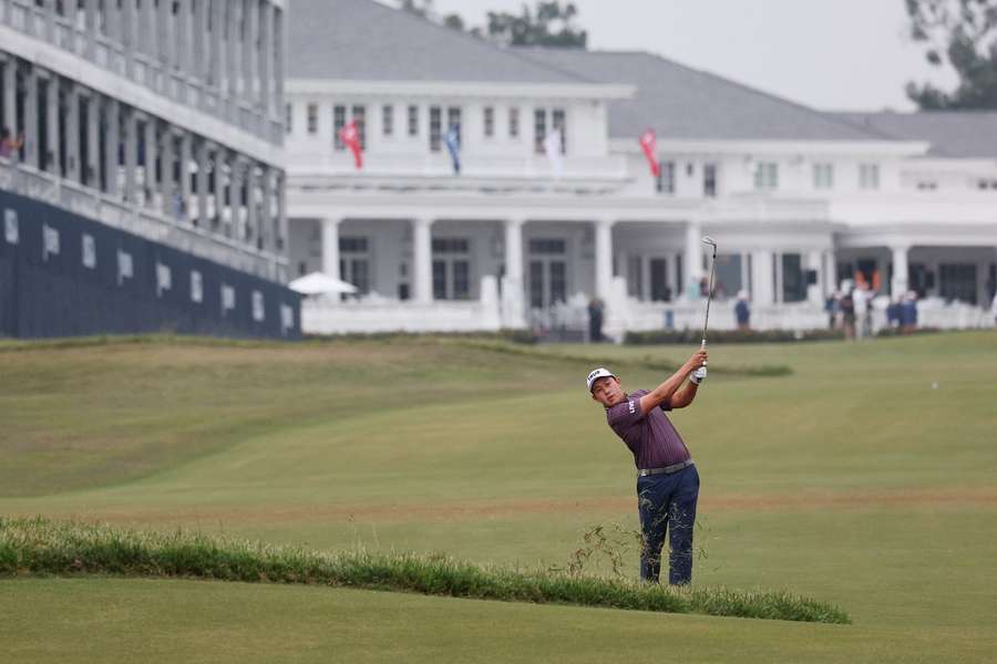 Dylan Wu of the United States plays his shot on the first hole during the first round