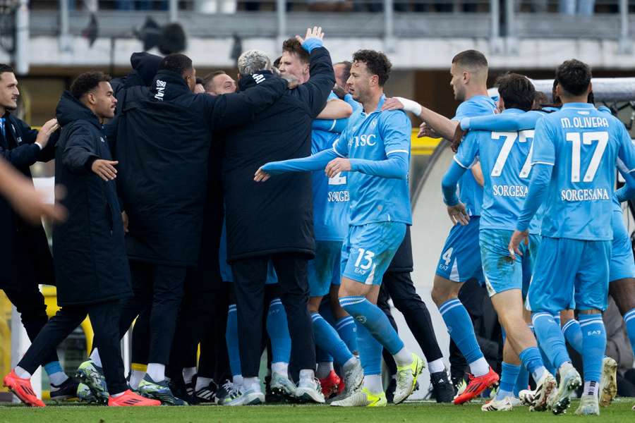 McTominay celebrating with staff after scoring winning goal
