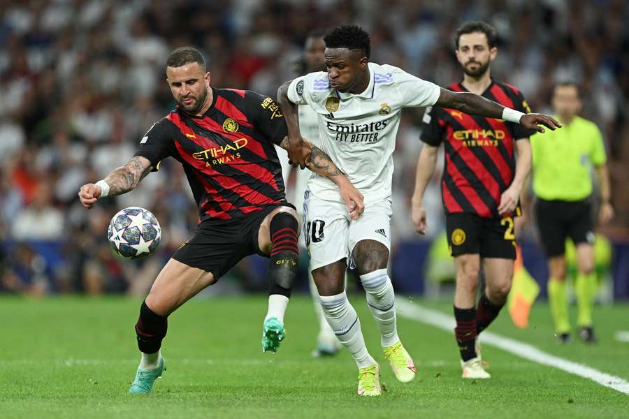 Vinicius Jr of Real Madrid is challenged by Kyle Walker of Manchester City in last season's Champions League semi-final