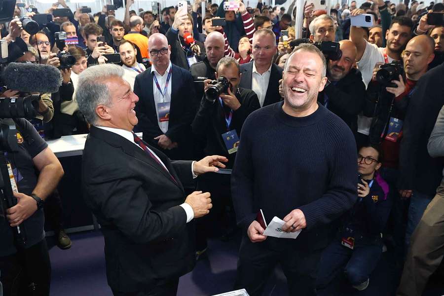 FC Barcelona coach Hansi Flick reacts with Joan Laporta before casting his vote in the elections