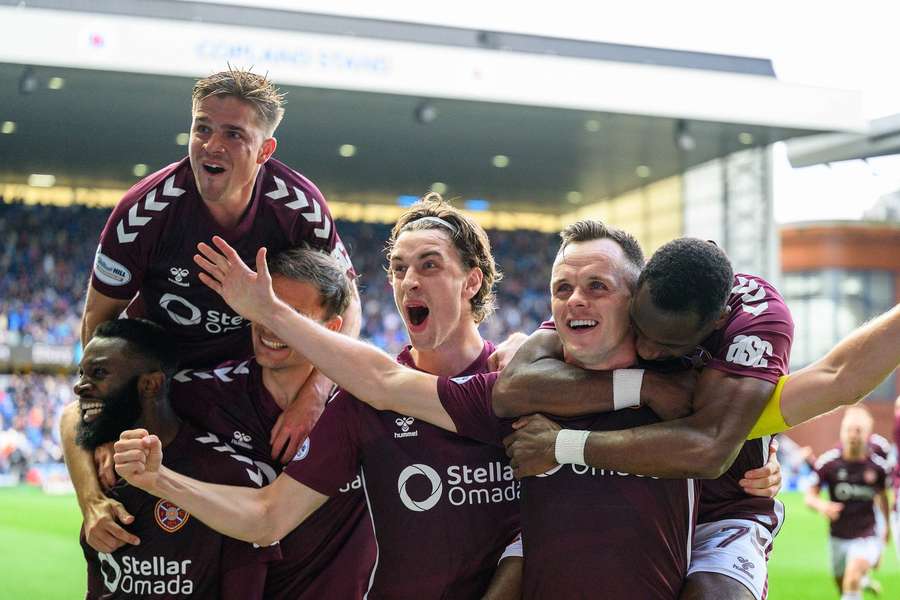 Hearts players celebrate at Ibrox