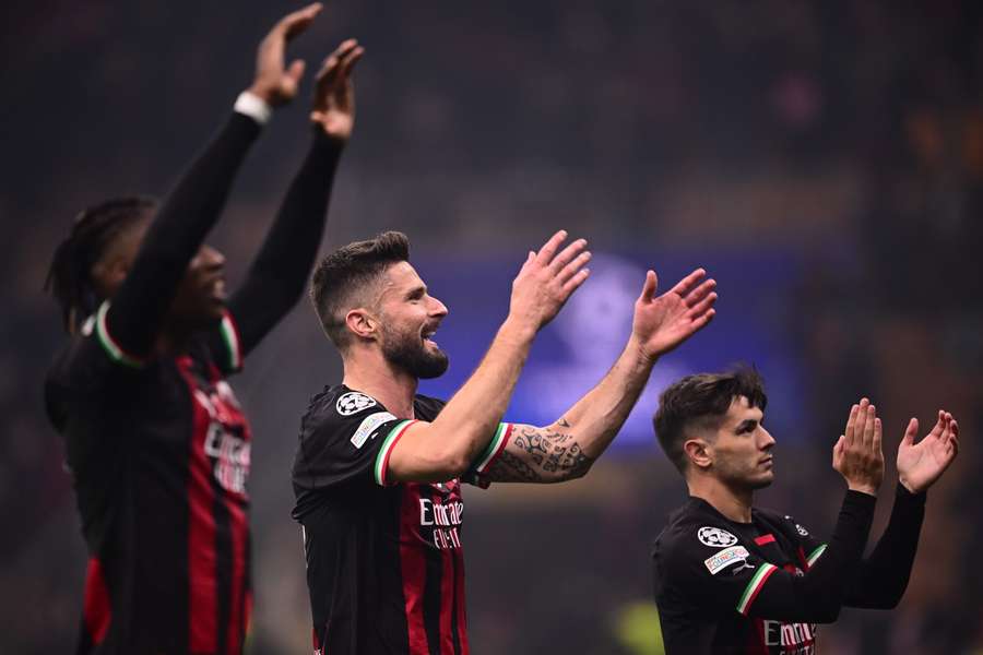 AC Milan's Portuguese forward Rafael Leao, French forward Olivier Giroud and Spanish midfielder Brahim Diaz acknowledge the fans after their win