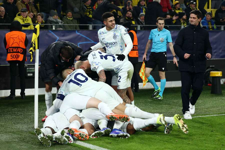 Andy Diouf is mobbed my his teammates after netting Inter's second