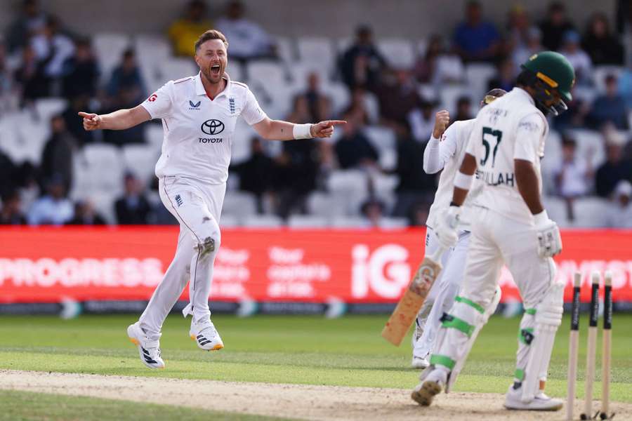 England's Ollie Robinson celebrates after taking the wicket of Pakistan's Abdullah Shafique 