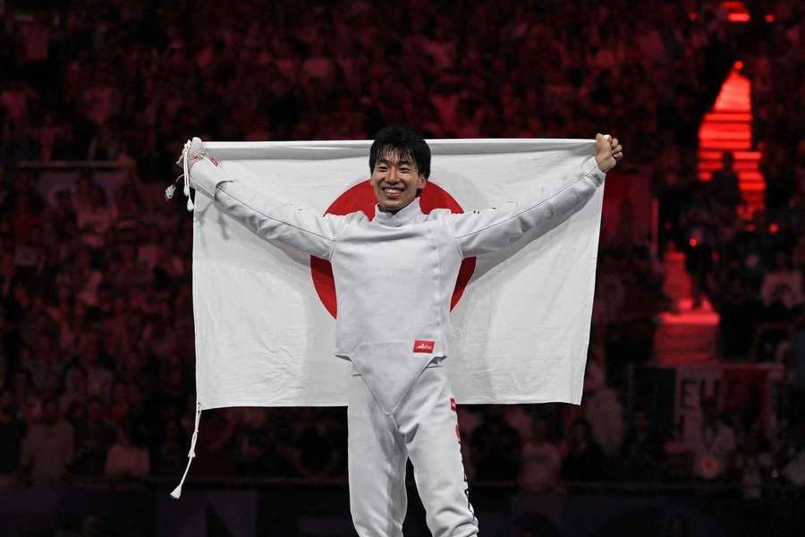 Japanner Kano met de vlag van zijn land