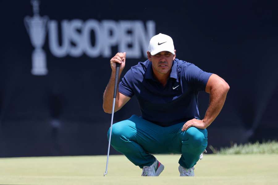 Brooks Koepka lines up a putt on the on the ninth green during the second round of the U.S. Open