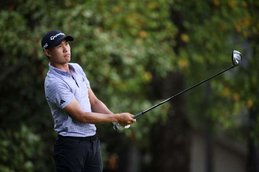 Collin Morikawa hits his shot from the 14th tee during the second round of the Tour Championship