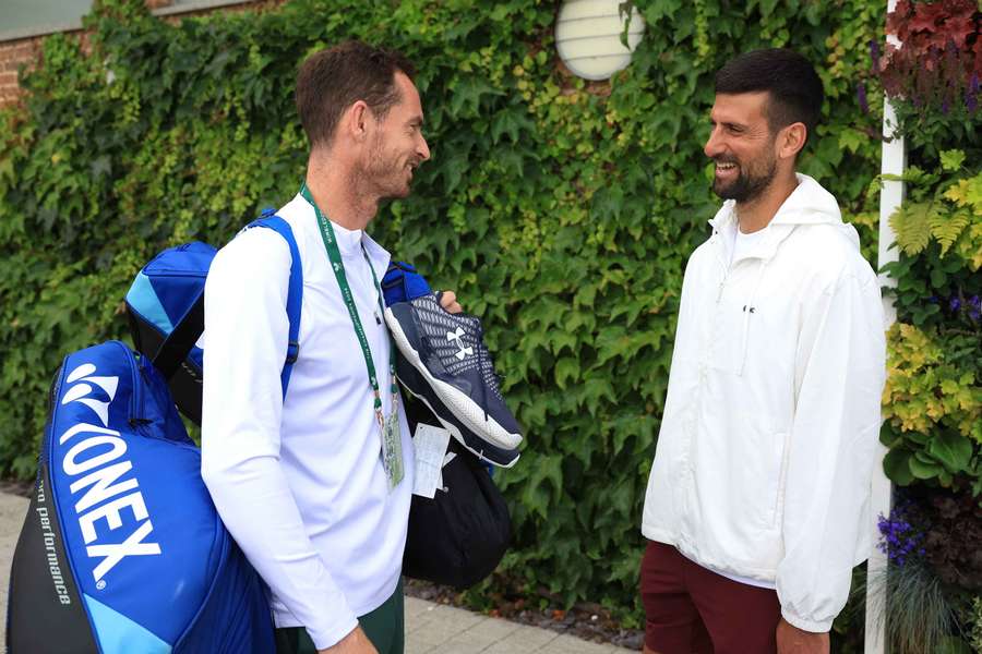 Novak Djokovic speaks to Andy Murray at Wimbledon in 2024