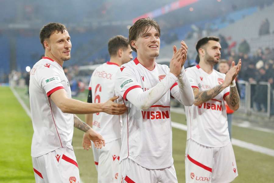 Dominik Franke and Justin Roth celebrate FC Thun's surprising win against FC Basel 