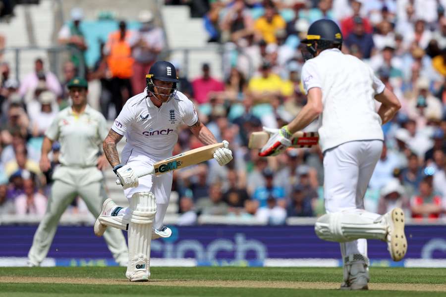 England captain Ben Stokes (L) and Zak Crawley (R) take a run