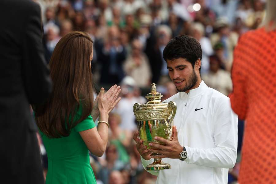 Britain's Catherine, Princess of Wales, presents the winner's trophy to Spain's Carlos Alcaraz after beating Serbia's Novak Djokovic