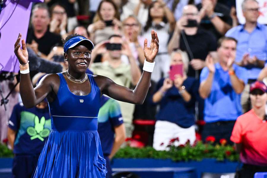 Victoria Mboko celebrates after beating Elena Rybakina