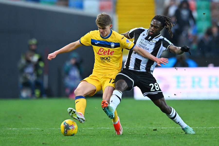 Atalanta's Charles De Ketelaere (left) tries to protect the ball from Oumar Solet