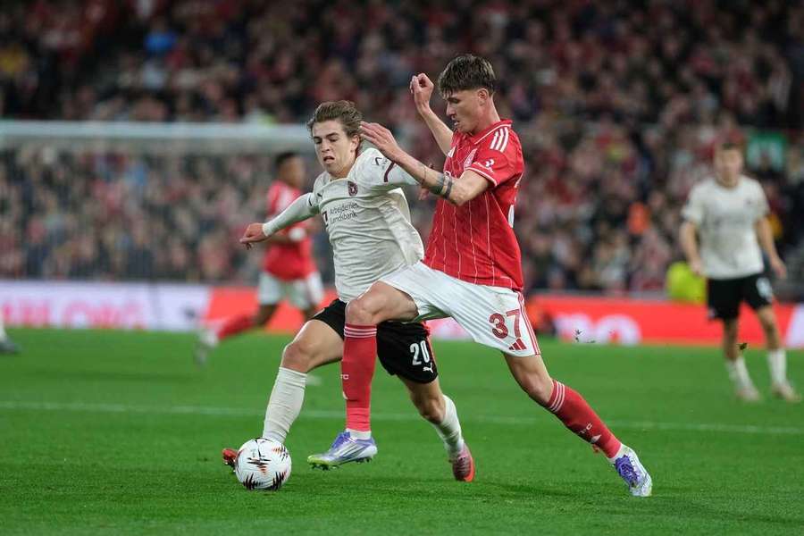 FC Midtjylland's Valdemar Byskov and Nicolo Savona of Nottingham Forest seen in action during the UEFA Europa league clash